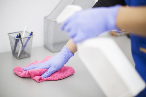 Cleaning professional preparing carpet cleaning equipment in a home interior