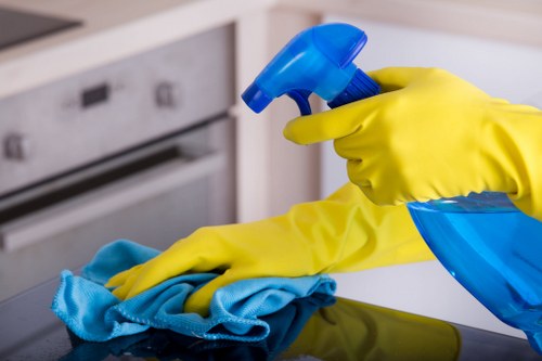 Technician managing carpet cleaning equipment and chemical handling safely